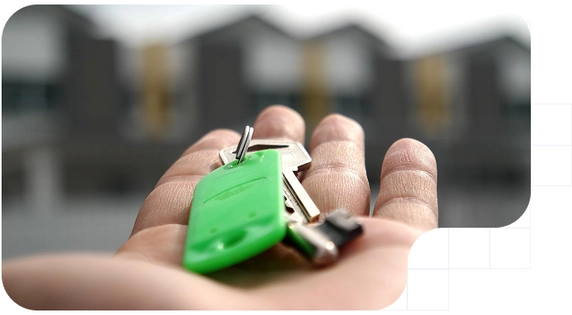 A person with the keys of his/her lease agreement house